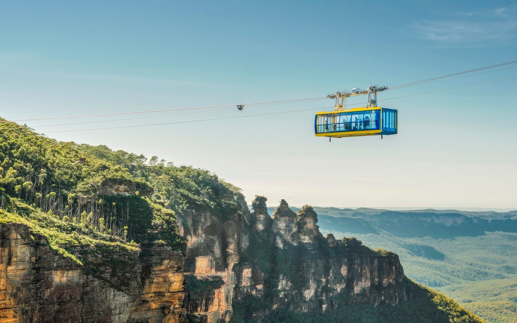 Cable car over Blue Mountains with view of Three Sisters rock formation, Australia.