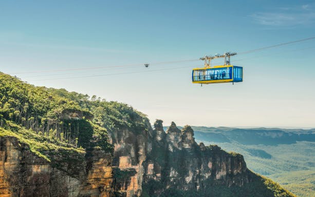 Cable car over Blue Mountains with view of Three Sisters rock formation, Australia.