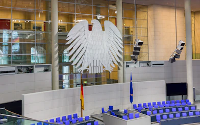 Reichstag Building interior with German eagle emblem, Berlin government district.