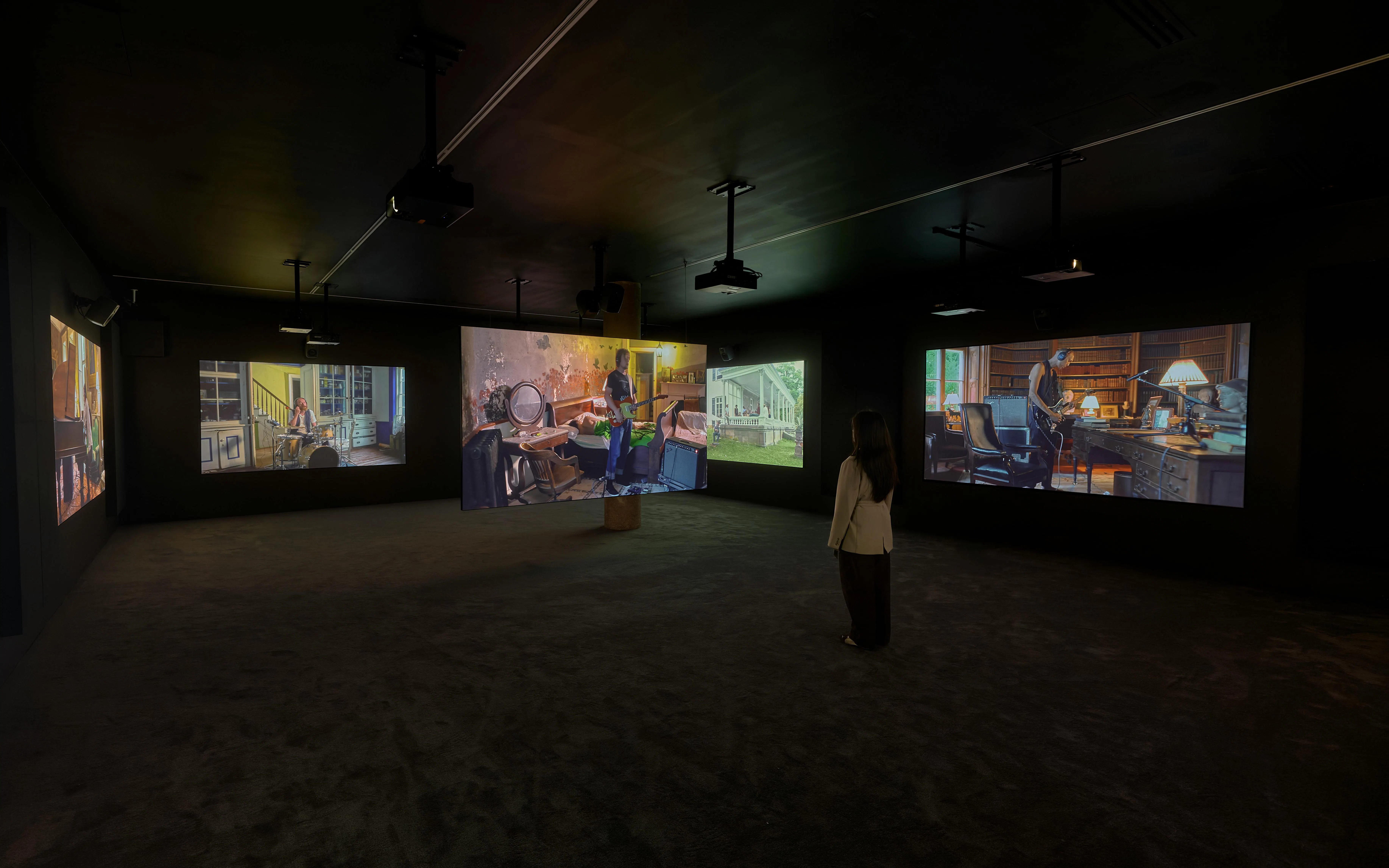 Visitor viewing Ragnar Kjartansson's Mercy exhibition at National Gallery of Victoria.