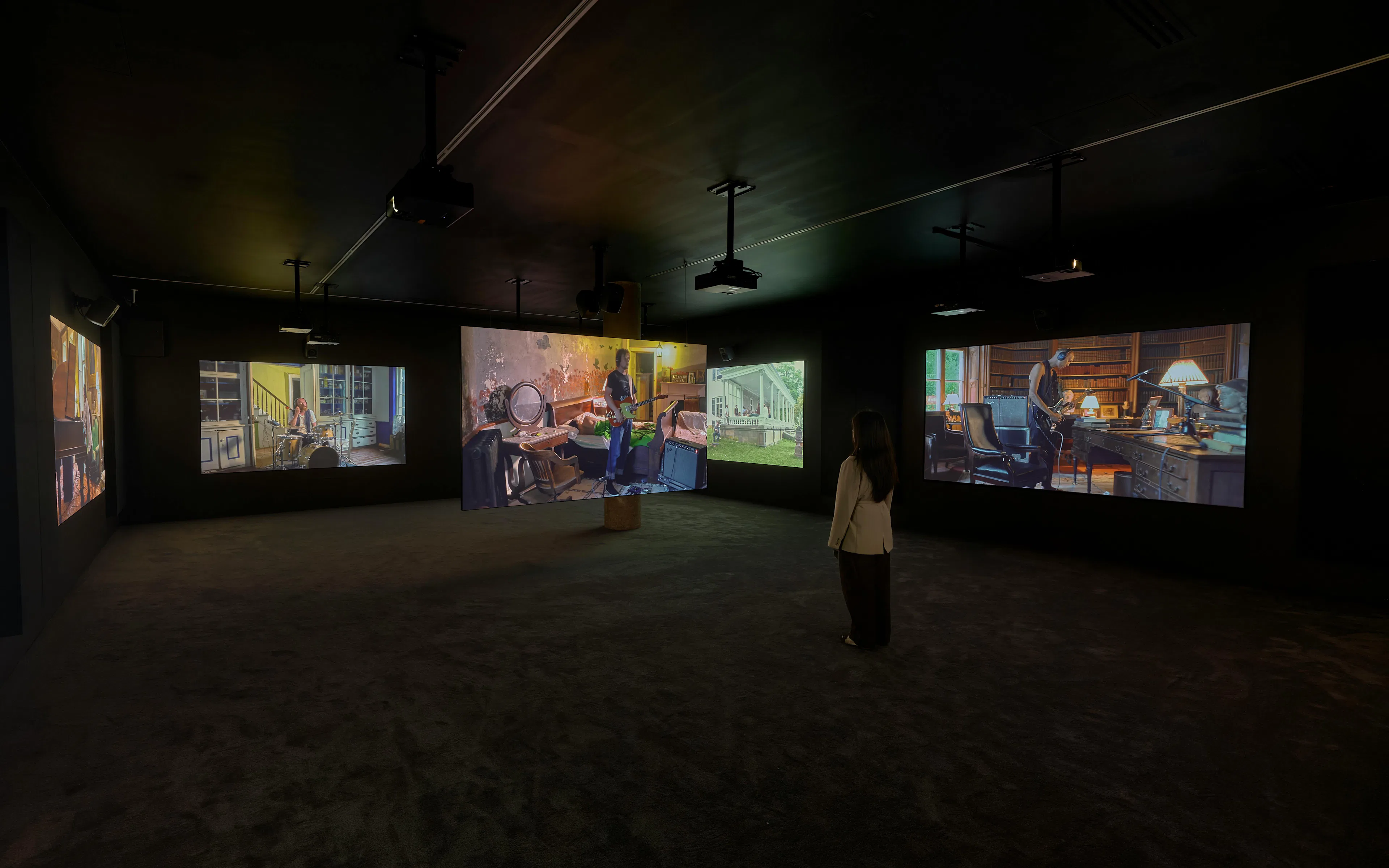 Visitor viewing Ragnar Kjartansson's Mercy exhibition at National Gallery of Victoria.
