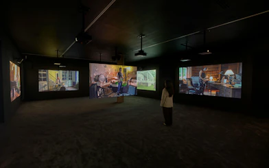 Visitor viewing Ragnar Kjartansson's Mercy exhibition at National Gallery of Victoria.
