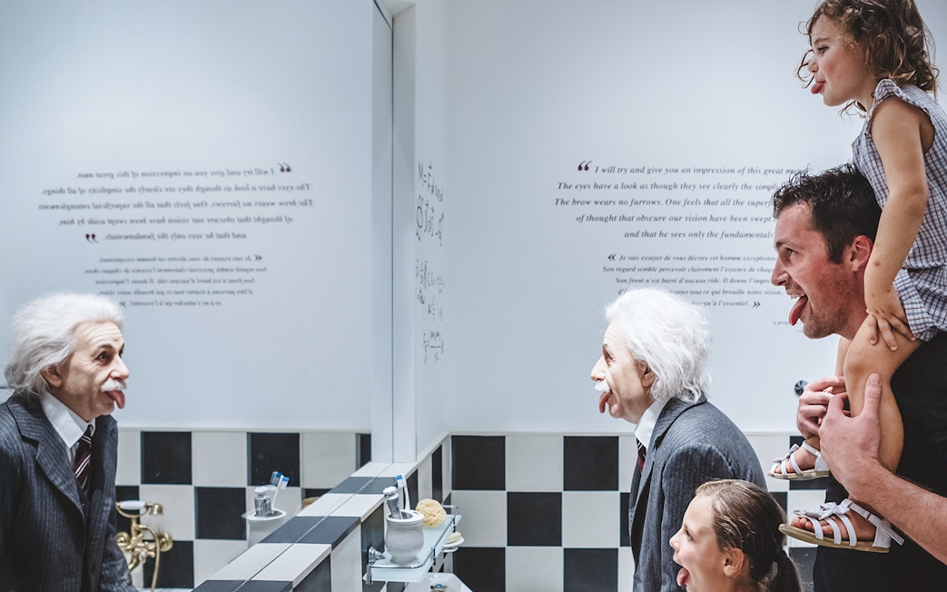 Family mimicking Einstein statue at Chaplin’s World, Lake Geneva tour.