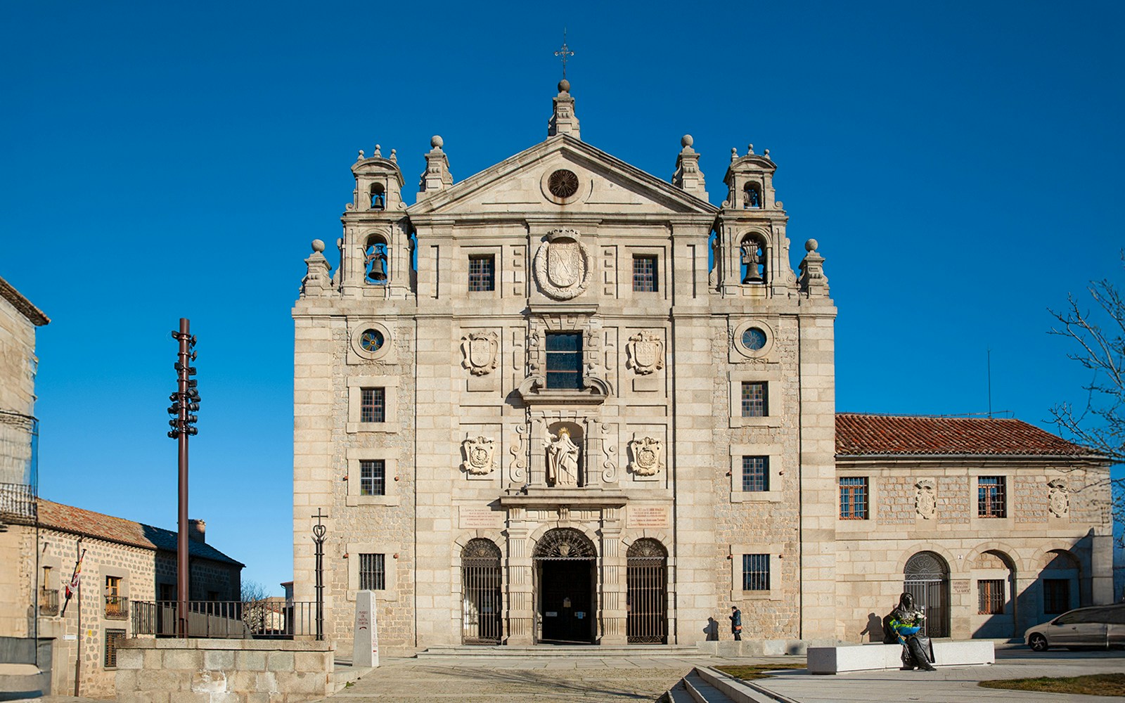 Church facade and statue at the birthplace of Saint Teresa of Jesus, Avila, Spain.
