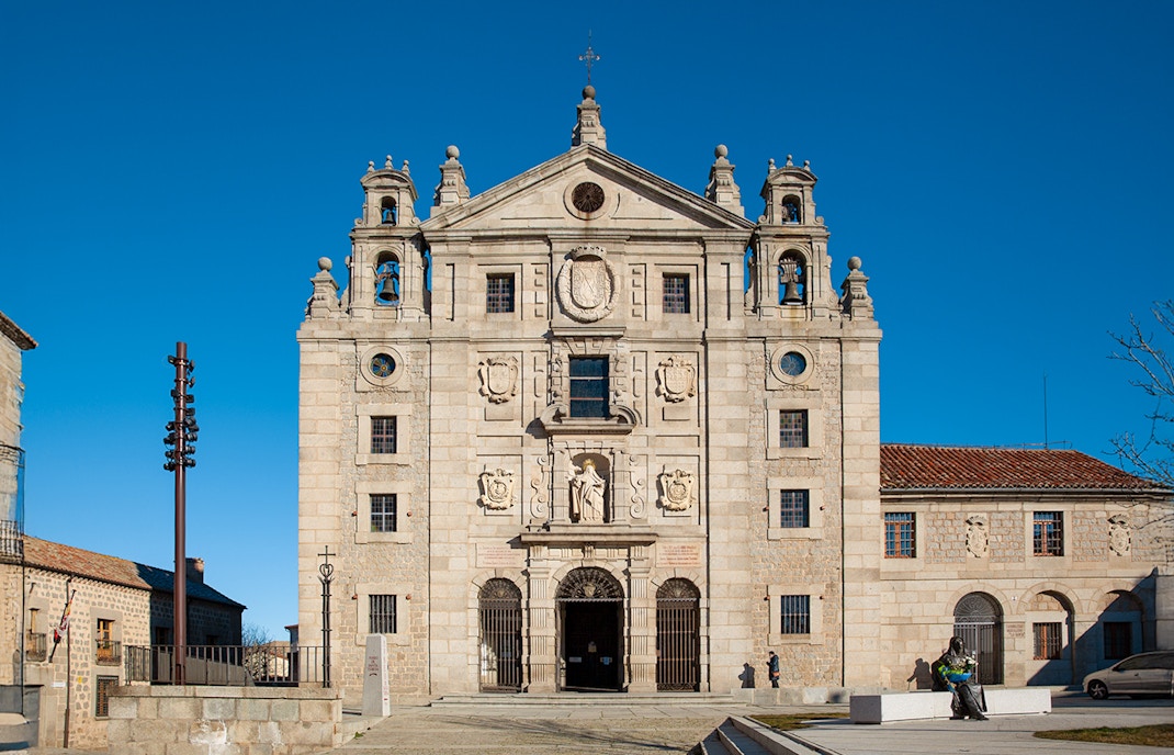 Church facade and statue at the birthplace of Saint Teresa of Jesus, Avila, Spain.