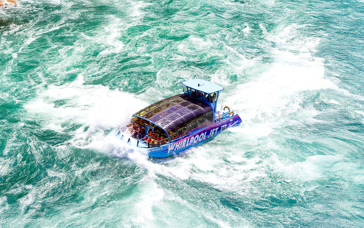 Guests enjoying the Freedom jet boat tour on the Niagara River Gorge, Niagara, Canada.
