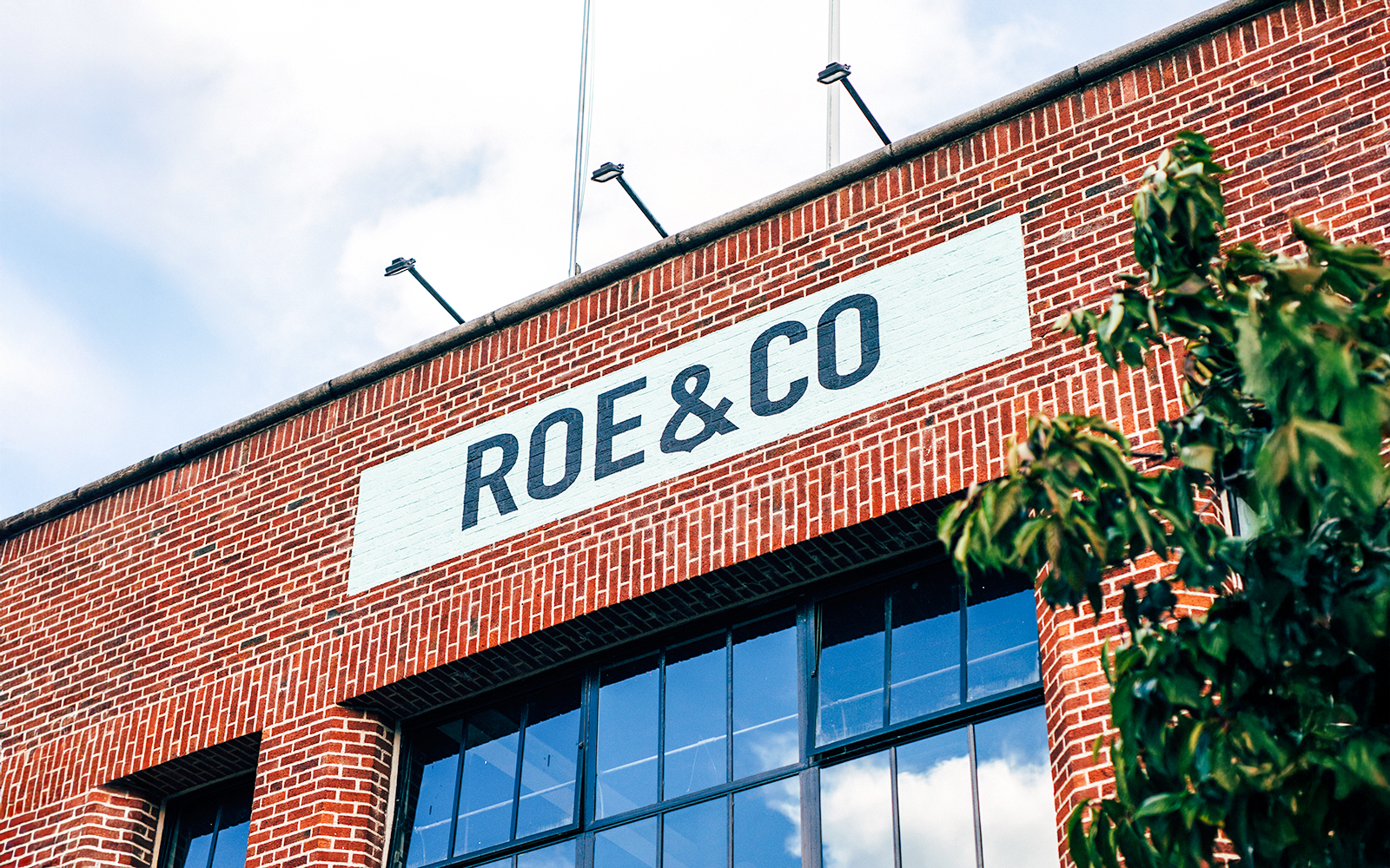 Roe & Co Distillery brick facade with signage in Dublin.