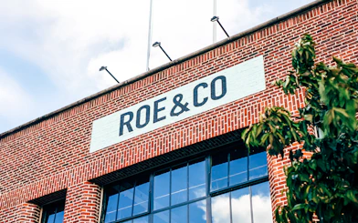 Roe & Co Distillery brick facade with signage in Dublin.