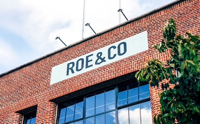 Roe & Co Distillery brick facade with signage in Dublin.