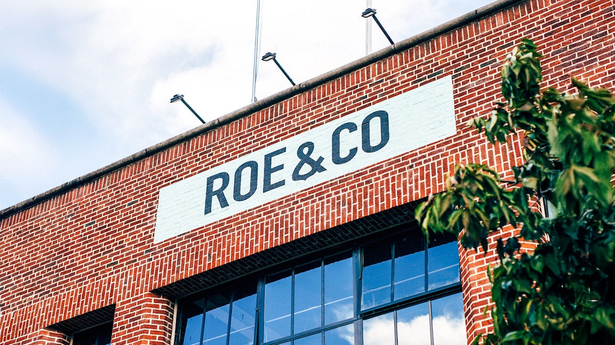 Roe & Co Distillery brick facade with signage in Dublin.