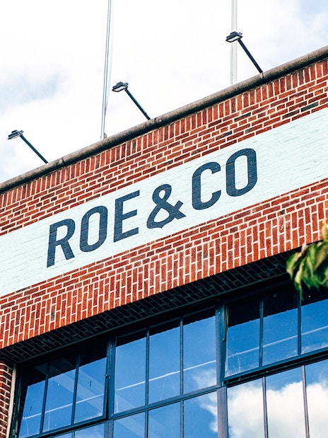 Roe & Co Distillery brick facade with signage in Dublin.
