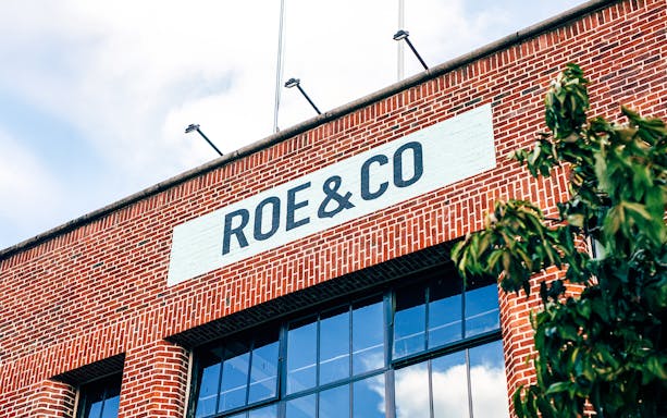 Roe & Co Distillery brick facade with signage in Dublin.