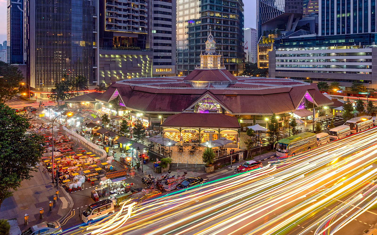Lau Pa Sat Festival Market illuminated at night in Singapore with bustling street food stalls.