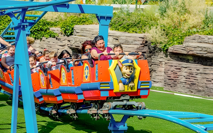 Children enjoying Paw Patrol ride at Parque de Atracciones de Madrid.