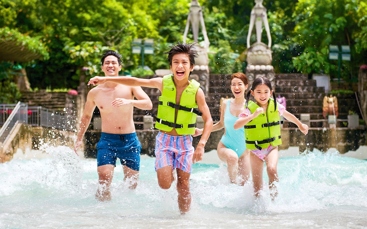 Guests enjoying the wave pool at Adventure Cove Waterpark™.
