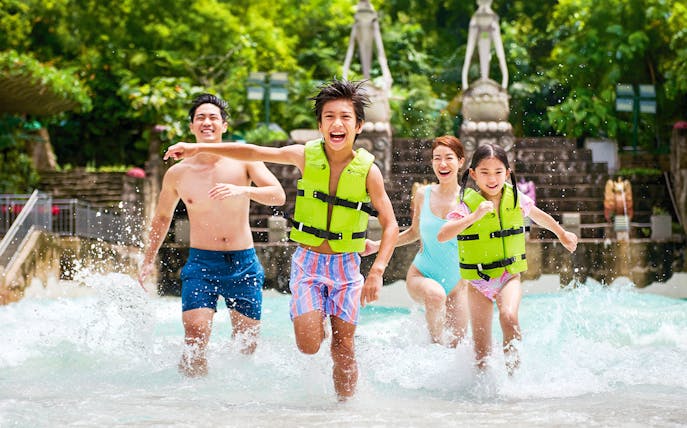 Guests enjoying the wave pool at Adventure Cove Waterpark™.