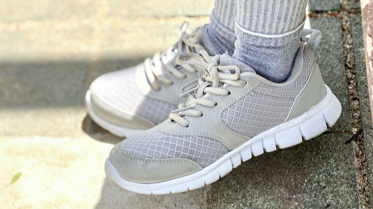 Walking shoes on a stone path.