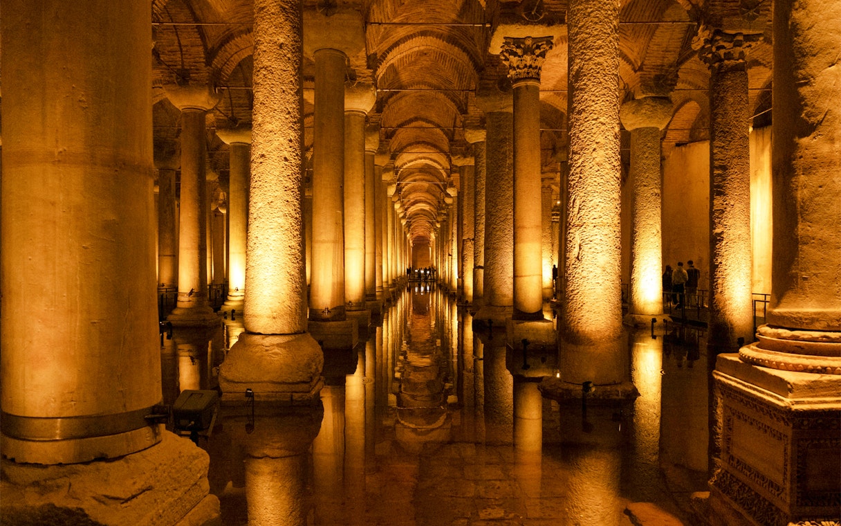 Basilica Cistern's illuminated columns and reflections in Istanbul.