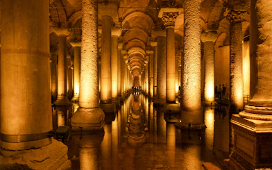 Basilica Cistern's illuminated columns and reflections in Istanbul.