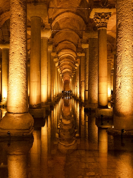Basilica Cistern's illuminated columns and reflections in Istanbul.