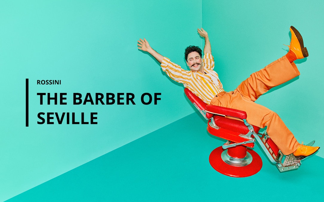 Man in striped shirt and orange pants in a red barber chair, promoting "The Barber of Seville.