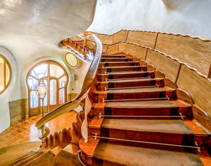 Curved wooden staircase inside Casa Batlló, Barcelona.
