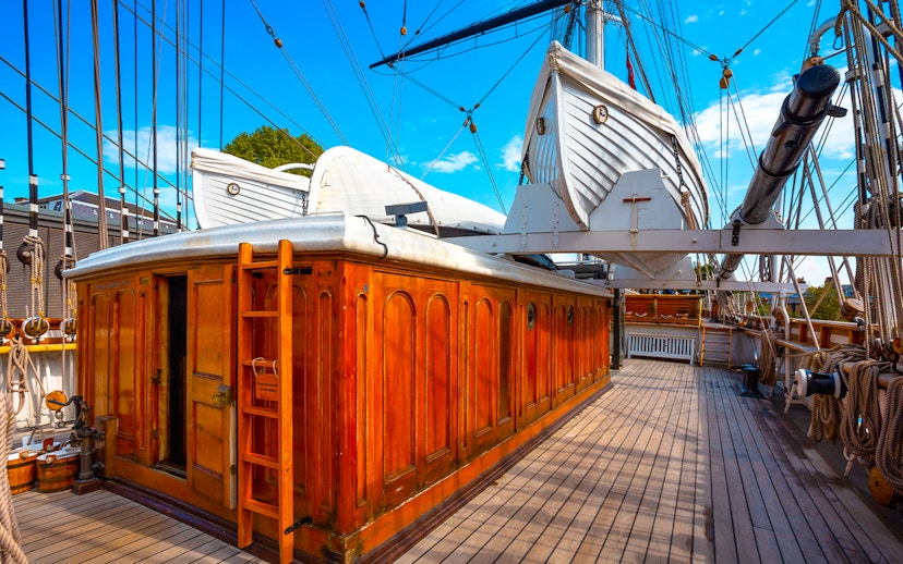 Cutty Sark deck with lifeboats and wooden cabin, Greenwich, London, UK.