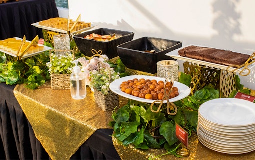 Buffet setup with desserts and fruits on a Marina Dinner Cruise.