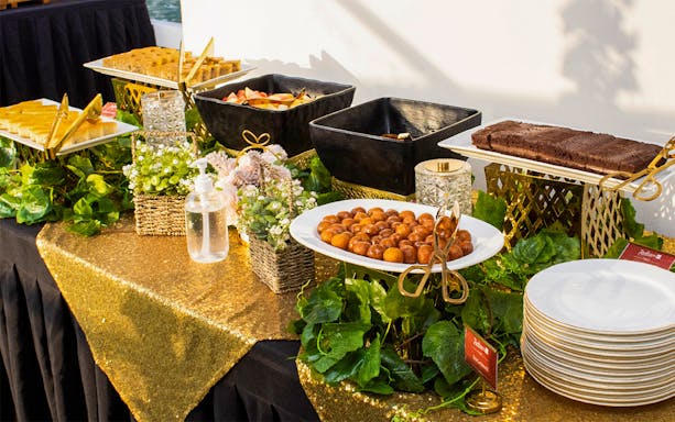 Buffet setup with desserts and fruits on a Marina Dinner Cruise.