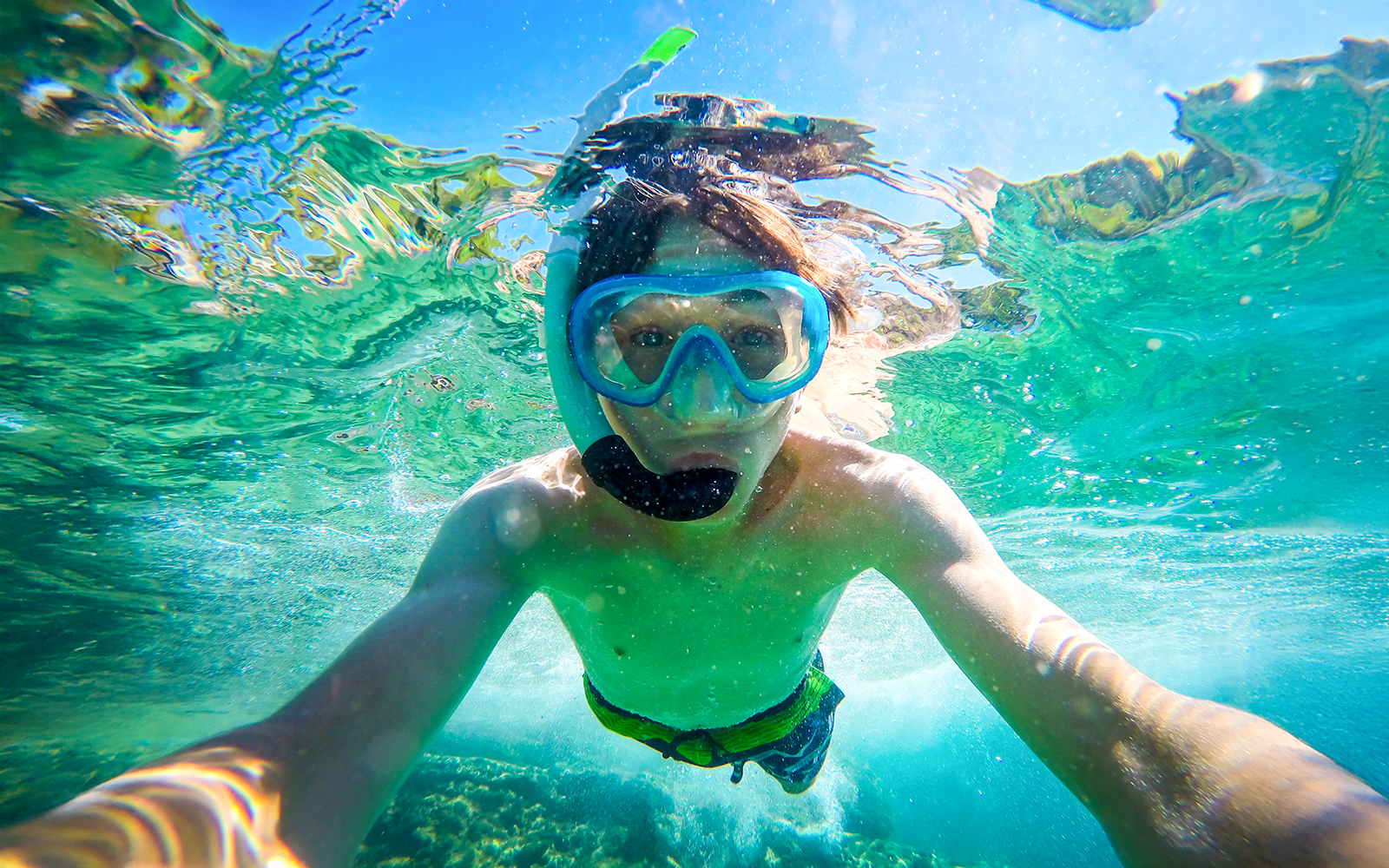 Snorkeler exploring clear waters during Blue Lagoon, Golden Horn, and Hvar speedboat tour.