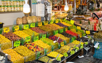 Variety of olives displayed at Kadikoy market, Istanbul, during street food tour.