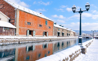 Otaru Canal in winter with snow-covered warehouses, Hokkaido, Japan.