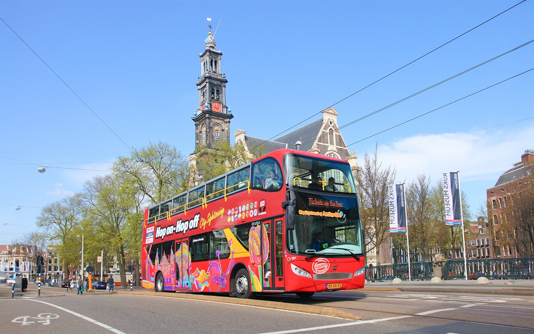 Hop on hop off bus in front of Westerkerk, Amsterdam.