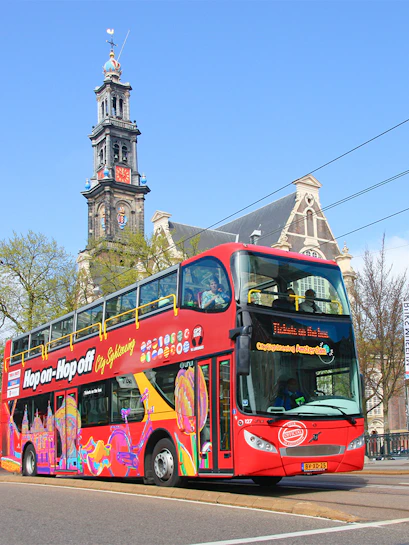 Hop on hop off bus in front of Westerkerk, Amsterdam.