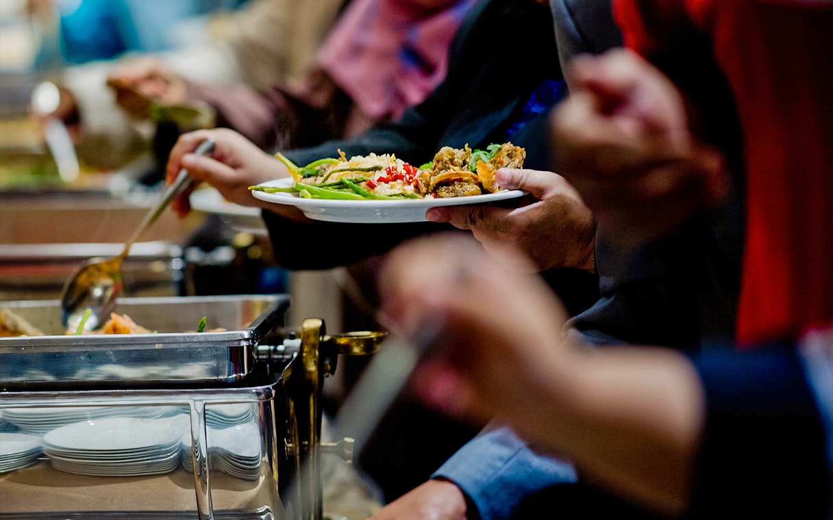 Buffet dining experience in Sydney with diverse dishes on a plate.