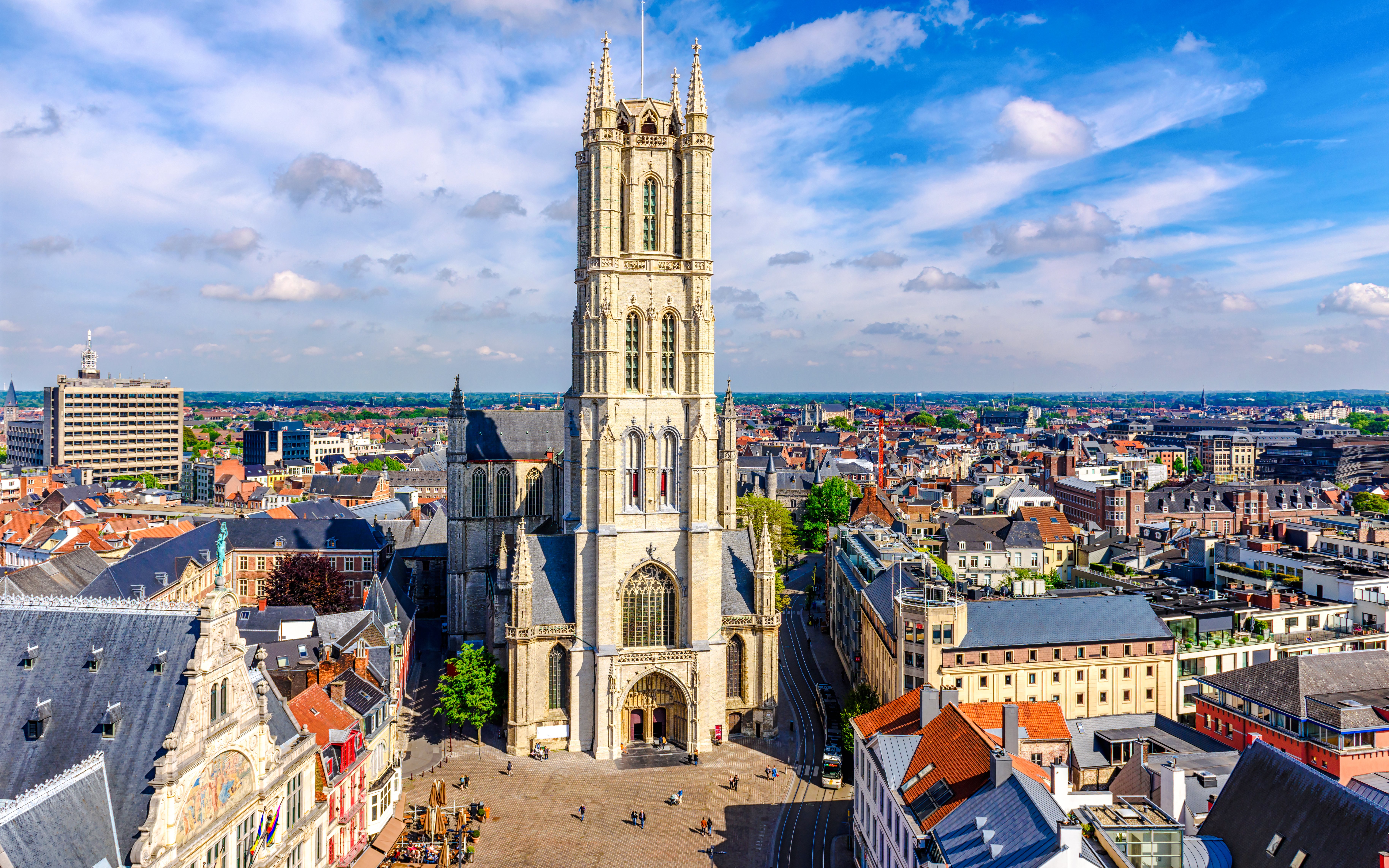 Saint Bavo Cathedral in Ghent, Belgium, with surrounding cityscape.