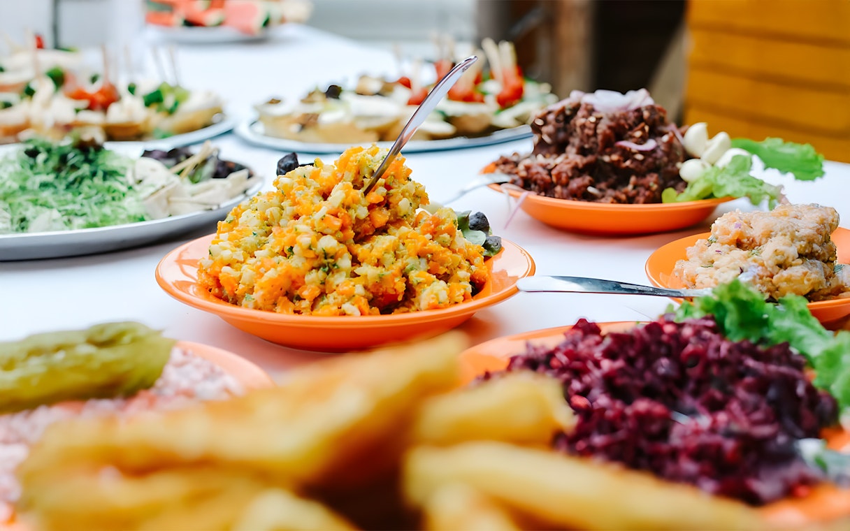 Luau Kalamaku buffet with imu roasted dishes and colorful salads.