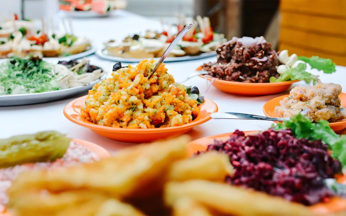 Luau Kalamaku buffet with imu roasted dishes and colorful salads.