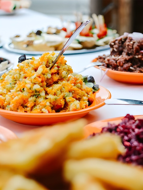 Luau Kalamaku buffet with imu roasted dishes and colorful salads.