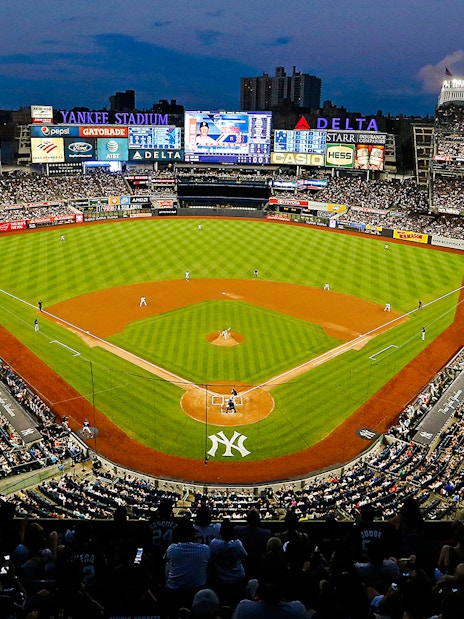 Yankee Stadium during a baseball game in New York City, packed with fans.