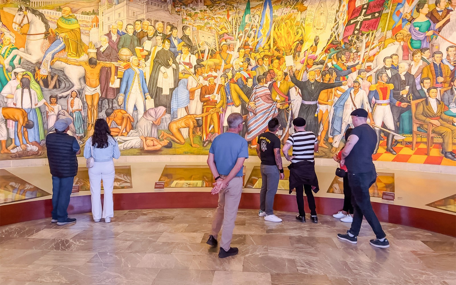 Visitors examining artifacts at the Anthropology Museum, Mexico City.
