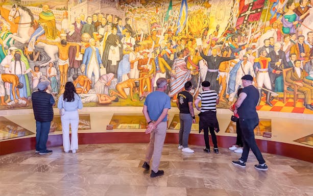 Visitors examining artifacts at the Anthropology Museum, Mexico City.