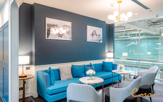 Business class lounge seating area at Coral Lounge, Bangkok airport, Thailand.