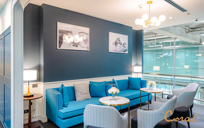 Business class lounge seating area at Coral Lounge, Bangkok airport, Thailand.