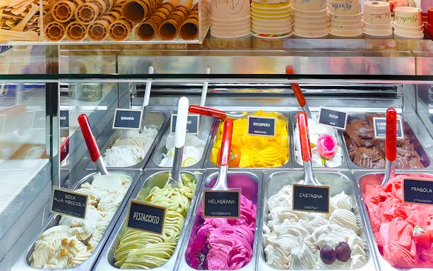 Gelato display with various flavors in Florence food tour.