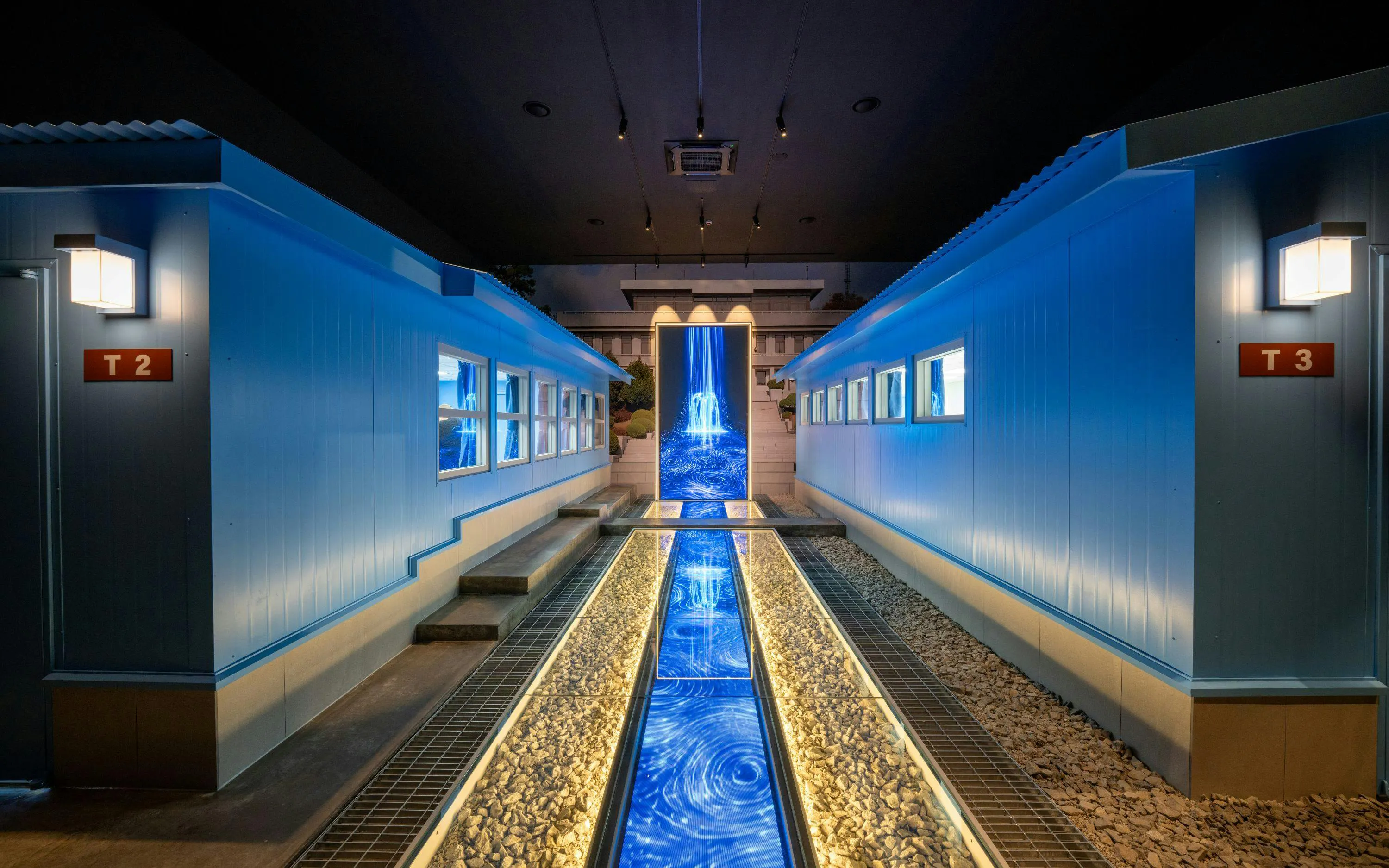 DMZ tour building interior with blue lighting and pathway, Seoul.