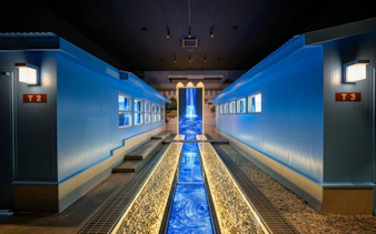 DMZ tour building interior with blue lighting and pathway, Seoul.