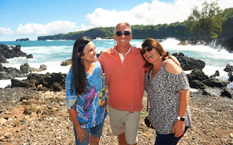 Group enjoying coastal view on Road to Hana Adventure Tour, Maui, Hawaii.