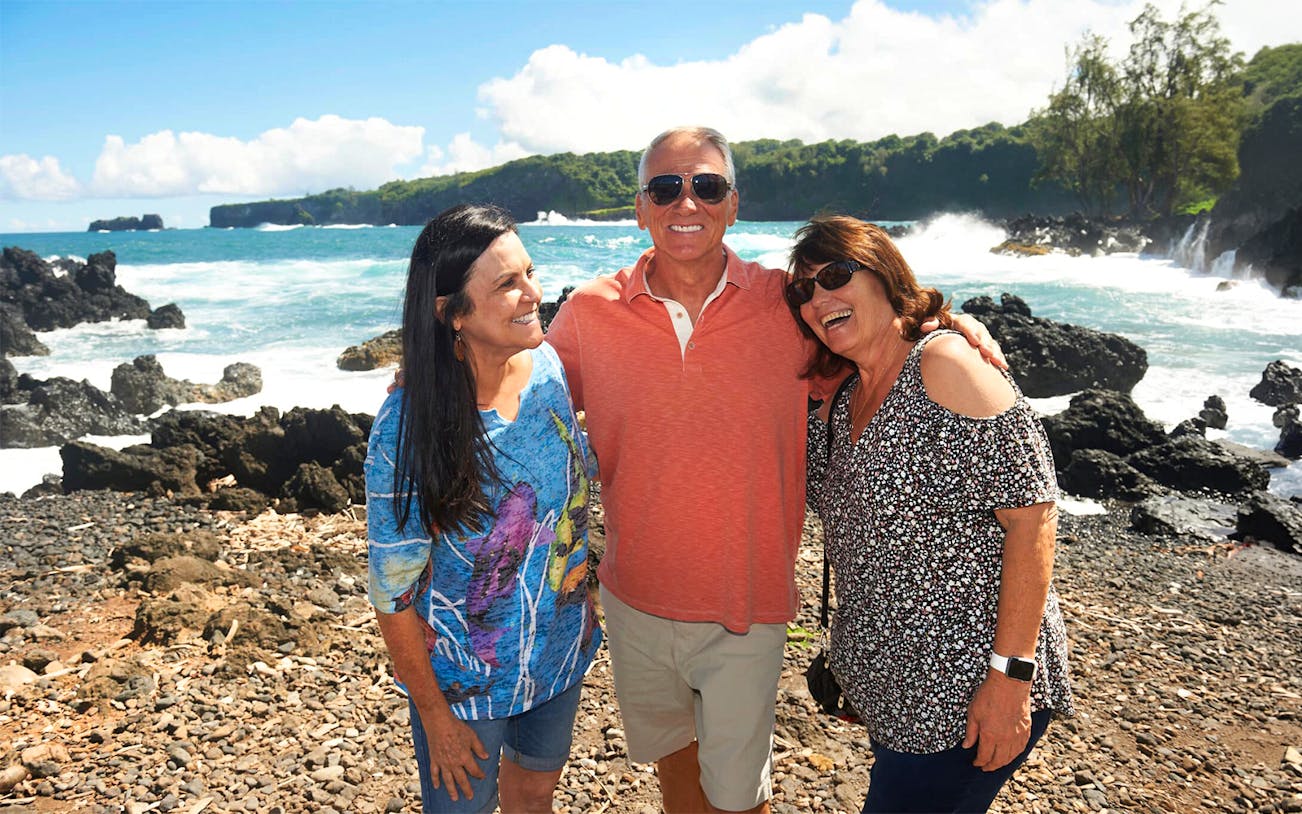 Group enjoying coastal view on Road to Hana Adventure Tour, Maui, Hawaii.