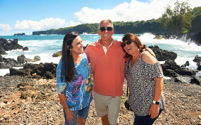 Group enjoying coastal view on Road to Hana Adventure Tour, Maui, Hawaii.